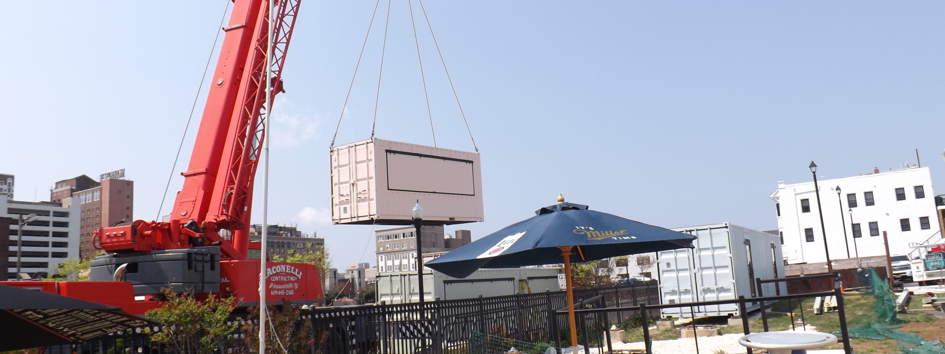 Shipping container being installed with a forklift